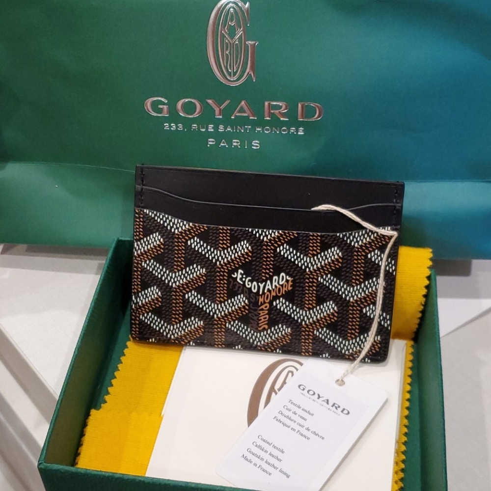 Goyard card holder, box, papers and receipt.